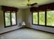 Bedroom with large windows, neutral walls, and a ceiling fan at 11967 Windpointe Pass, Carmel, IN 46033