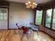 Charming breakfast nook with hardwood floors, a chandelier, and a view of the backyard at 11967 Windpointe Pass, Carmel, IN 46033