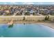 Breathtaking aerial view of a community by a lake, highlighting the homes and scenic walking path at 1283 Cliff View Dr, Westfield, IN 46074
