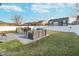 Spacious backyard featuring a patio with outdoor furniture and a well-maintained lawn, perfect for entertaining at 1283 Cliff View Dr, Westfield, IN 46074