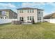 Expansive backyard with a patio featuring an outdoor dining set and grill, great for summer barbecues at 1283 Cliff View Dr, Westfield, IN 46074