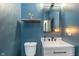 Stylish powder room featuring a vanity, decorative mirror, and contemporary lighting at 1283 Cliff View Dr, Westfield, IN 46074