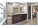 Spacious primary bathroom boasts dual sinks, modern fixtures, and wood-look flooring at 1283 Cliff View Dr, Westfield, IN 46074