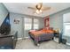 This large bedroom has a ceiling fan and sports-themed decor at 1283 Cliff View Dr, Westfield, IN 46074