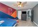 Well-lit bedroom with ceiling fan and sports-themed decor at 1283 Cliff View Dr, Westfield, IN 46074