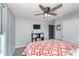 Relaxing bedroom featuring a ceiling fan, carpeted floors, and custom shelving at 1283 Cliff View Dr, Westfield, IN 46074