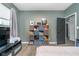 Bedroom showcasing modern decor, built-in shelving, and an open doorway to other spaces at 1283 Cliff View Dr, Westfield, IN 46074