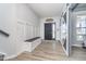 Inviting entryway with coat hooks, bench, and a modern sliding barn door at 1283 Cliff View Dr, Westfield, IN 46074