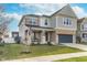 Charming two-story home with a welcoming porch and neatly landscaped front yard at 1283 Cliff View Dr, Westfield, IN 46074