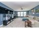 Spacious living room featuring modern furniture, large windows, and a wall-mounted TV at 1283 Cliff View Dr, Westfield, IN 46074