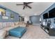Cozy living room featuring a comfortable sectional, a ceiling fan, and wall decorations at 1283 Cliff View Dr, Westfield, IN 46074