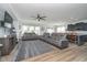 Open-concept living room with modern furniture, ceiling fan, and stylish decor at 1283 Cliff View Dr, Westfield, IN 46074