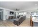 Spacious living room featuring a ceiling fan, large sofa, and lots of natural light at 1283 Cliff View Dr, Westfield, IN 46074