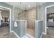 Large glass shower with tiled surround and brushed nickel fixtures at 1283 Cliff View Dr, Westfield, IN 46074