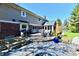 Expansive backyard patio with grill, outdoor dining set, and beautiful landscaping, ideal for outdoor living at 12917 Brighton Ln, Carmel, IN 46032
