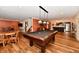 Spacious finished basement with a pool table, seating area, and bar for entertaining at 12917 Brighton Ln, Carmel, IN 46032
