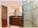 Modern bathroom with a glass shower and a granite countertop vanity at 12917 Brighton Ln, Carmel, IN 46032