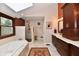 Bright bathroom features a soaking tub, walk-in shower, and double vanity with storage at 12917 Brighton Ln, Carmel, IN 46032