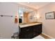 Elegant bathroom with a granite countertop, dual sinks, and a large mirror at 12917 Brighton Ln, Carmel, IN 46032