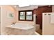 Bright bathroom featuring an enclosed shower and soaking tub with natural light at 12917 Brighton Ln, Carmel, IN 46032