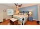 Charming bedroom featuring hardwood floors and a window with natural light at 12917 Brighton Ln, Carmel, IN 46032