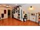 Bright walk-in closet provides ample storage space with custom shelving and hardwood floors at 12917 Brighton Ln, Carmel, IN 46032