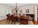 Formal dining room with a large table, elegant chandelier, and classic decor for memorable gatherings at 12917 Brighton Ln, Carmel, IN 46032