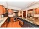 Elegant kitchen boasts a center island, granite countertops, and premium stainless steel appliances at 12917 Brighton Ln, Carmel, IN 46032