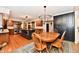 Spacious kitchen with a large island, stainless steel appliances, and a wooden dining set at 12917 Brighton Ln, Carmel, IN 46032