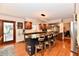 Modern kitchen features a large island with seating, wooden cabinets, and stainless steel appliances at 12917 Brighton Ln, Carmel, IN 46032