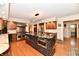 Gourmet kitchen with a large island, custom cabinetry, and stainless steel appliances at 12917 Brighton Ln, Carmel, IN 46032