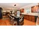 Bright, open kitchen featuring a black marble island, wooden cabinets, and stainless steel appliances at 12917 Brighton Ln, Carmel, IN 46032