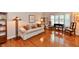 Inviting living room featuring hardwood floors, a patterned sofa, and natural light at 12917 Brighton Ln, Carmel, IN 46032