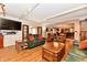 Bright living room with hardwood floors, comfortable seating, and views to the back yard at 12917 Brighton Ln, Carmel, IN 46032
