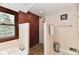 Walk-in shower with pebble floor and brick wall accents complements the bathroom space at 12917 Brighton Ln, Carmel, IN 46032