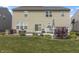 View of back of home, large backyard with new deck and stone patio with bbq at 12959 Balfour Rd, Fishers, IN 46037