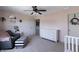 This bright bedroom is decorated in pink, with carpet, a ceiling fan, and white furniture at 12959 Balfour Rd, Fishers, IN 46037