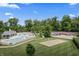 Aerial view of a community with a pool, tennis courts, volleyball court and playground at 12959 Balfour Rd, Fishers, IN 46037