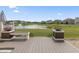 A view of the seating on the new deck with scenic views of the pond and community at 12959 Balfour Rd, Fishers, IN 46037