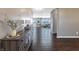 Inviting entryway featuring dark hardwood floors, neutral walls, and decorative console table at 12959 Balfour Rd, Fishers, IN 46037