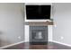 Close-up of the fireplace with shiplap accent, rustic mantel, and a cozy, inviting ambiance at 12959 Balfour Rd, Fishers, IN 46037