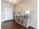 Spacious foyer features wood floors, a stylish console table, and a decorative rug at 12959 Balfour Rd, Fishers, IN 46037