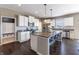 Modern kitchen with granite counters, white cabinetry, stainless steel appliances, and a large central island at 12959 Balfour Rd, Fishers, IN 46037