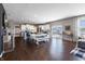 Open-concept features hardwood floors, neutral paint, an island, dining area and modern appliances at 12959 Balfour Rd, Fishers, IN 46037