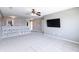 Bright lofted living room features a storage console and neutral carpet throughout at 12959 Balfour Rd, Fishers, IN 46037