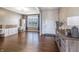 Spacious living room features wood floors, built-in shelves, and lots of natural light at 12959 Balfour Rd, Fishers, IN 46037