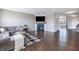 Spacious living room boasts hardwood floors, large windows, and a stylish fireplace feature at 12959 Balfour Rd, Fishers, IN 46037