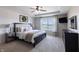Main bedroom features a trey ceiling, window views and a modern aesthetic at 12959 Balfour Rd, Fishers, IN 46037