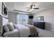 Bedroom with a tray ceiling, fan, large window with a view, and well-designed furniture at 12959 Balfour Rd, Fishers, IN 46037