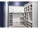 Custom mudroom features ample storage with shelving, hooks, and cabinets for optimal organization at 12959 Balfour Rd, Fishers, IN 46037